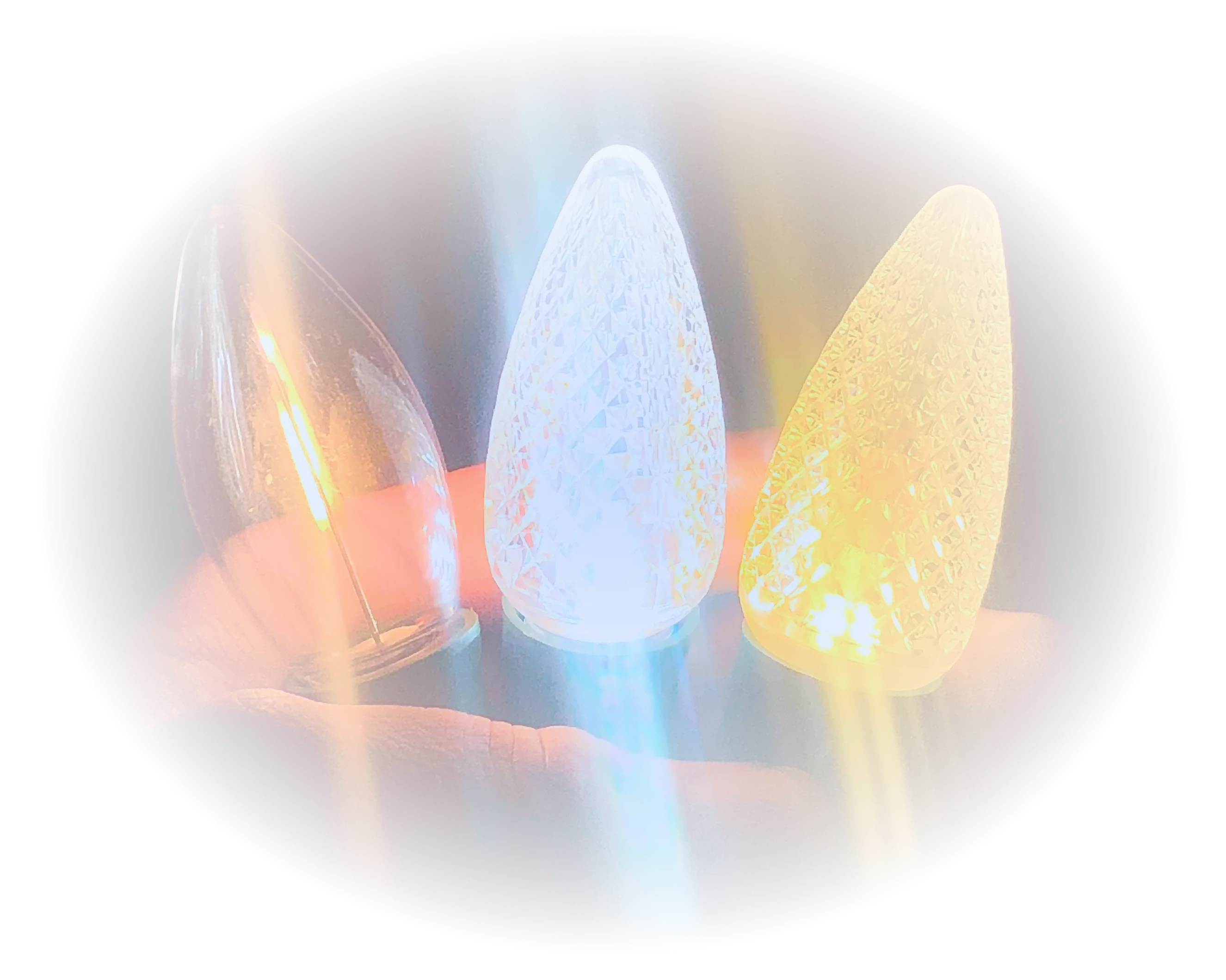 Hands holding illuminated Christmas lights